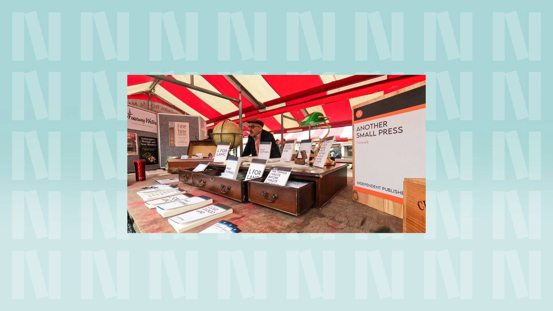 The background is light blue with the "N" logo for Newark Book Festival.